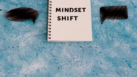 Positivity and law of attraction, notepad with Mindset Shift text with differ Stock Footage 144960313