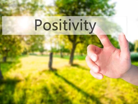 Positivity - Hand pressing a button on blurred background concept on visual s Stock Photos