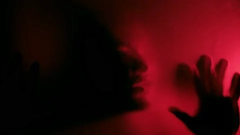 Possessed man scratching glass with hands Stock Footage 141215080