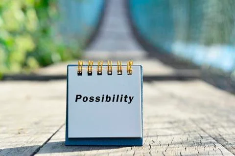 Possibility text written on white note with blurred background Stock Photos