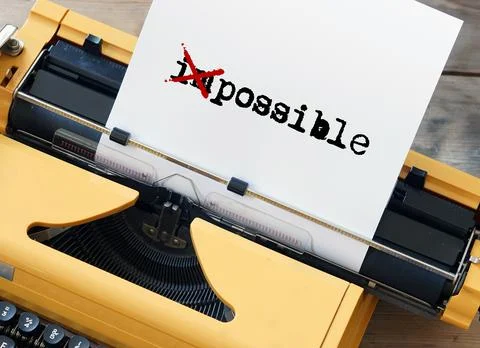 Possible impossible - word on sheet of paper written on yellow typewriter Stock Photos