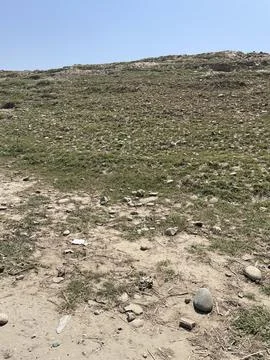 Possible Tipi Ring Site in a Rural Pakistani Landscape Stock-Fotos