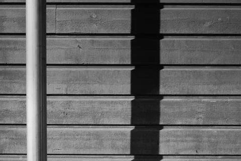 Post and it's shadow Stock Photos