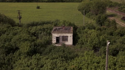 Post Apocalyptic Drone Shot Over Ruined Building and Empty Train Tracks Stock Footage 335486565