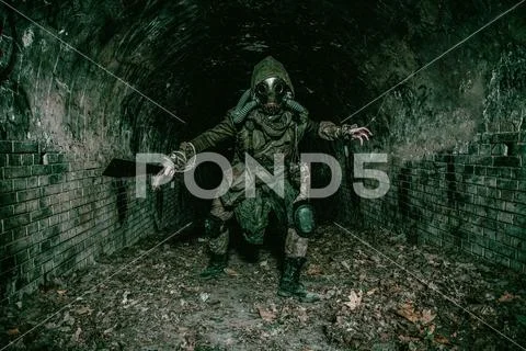 Post apocalyptic underground creature in gas mask Stock Photos