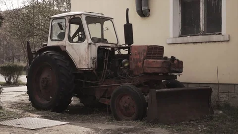 Post apocalyptic world after nuclear war. Abandoned tractor in apocalypse Stock Footage 115275990
