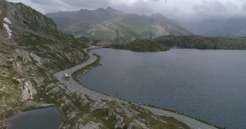 Post bus passing Grimsel Totensee - Aerial 4K Stock Footage 93735433