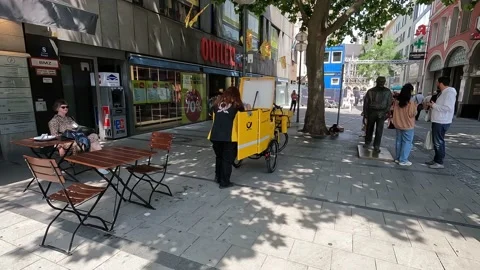 Post employee delivering post using a tricycle Stock Footage 238772587