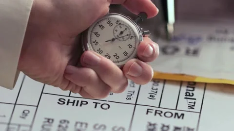 Post envelope label in closeup and stopwatch in a hand Видео 235154715