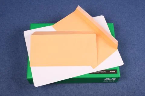 Post envelope on pack of  white paper Stock Photos