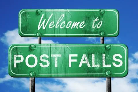 Post falls vintage green road sign with blue sky background Stock Illustration