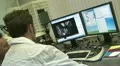 Post-graduate student at the computer in the lab HD Footage