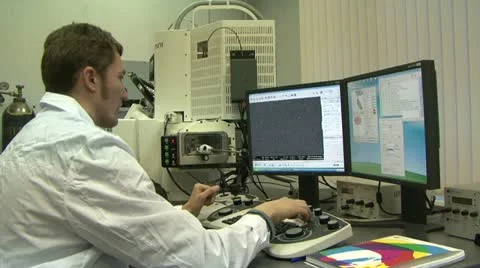 Post-graduate student at the computer in the lab 스톡 동영상 10830718