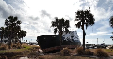 Post Hurricane Michael drive by beached large steel vessel in Port St. Joe Fl. Stock Footage 98133034