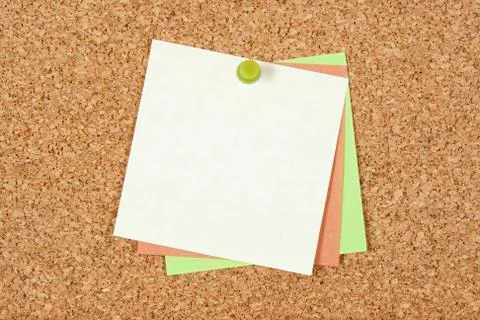 Post-it notes pinned to corkboard Stock Photos