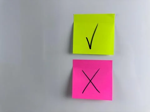Post it notes with tick and cross when choosing answer option Stock Photos