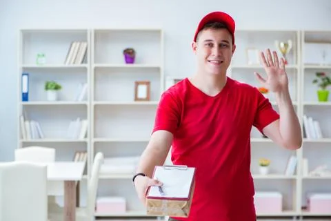 Post man delivering a parcel package Stock Photos