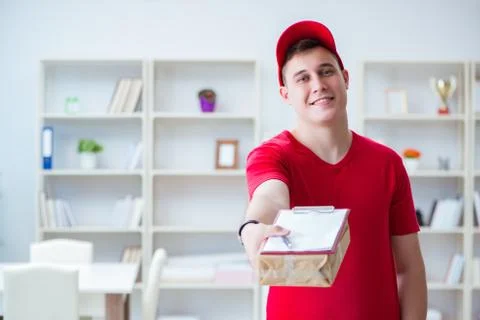 Post man delivering a parcel package Foto stock