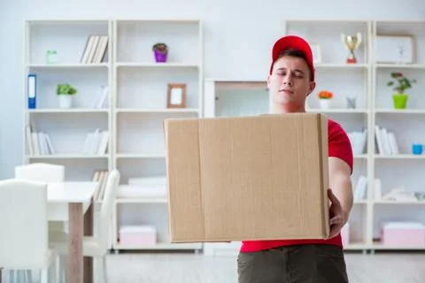 Post man delivering a parcel package Stockfoto's
