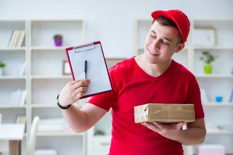 Post man delivering a parcel package Stock Photos