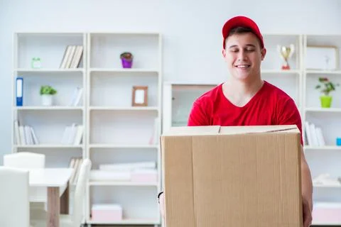 Post man delivering a parcel package Foto stock