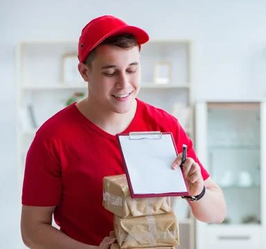 Post man delivering a parcel package Foto stock