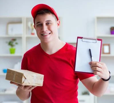 Post man delivering a parcel package Foto stock