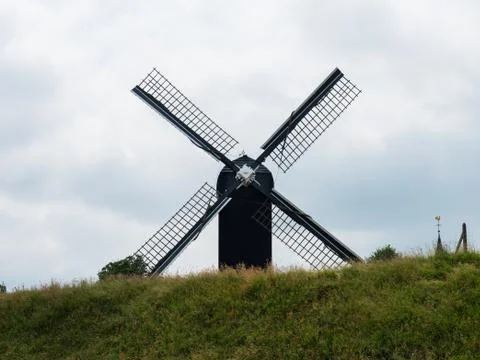 Post mill type windmill in Dutch landscape Stock Photos