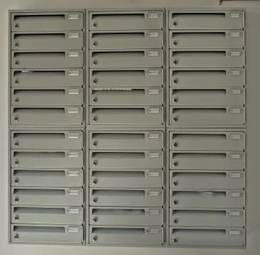 Post Office Boxes in Building on white Wall Foto stock