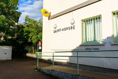 Post office building with La Poste sign in Saint-Honore-les-Bains, France. Stock Photos