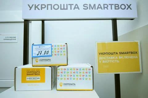Post office. Parcels in boxes placed on a table, service SmartBox advance p.. Stock Photos