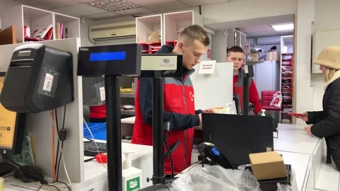 Post office a place to send parcels a lot of different parcels in the background Stock Footage 230040454