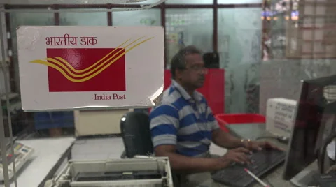 Post office, sending a parcel, checking the address, India Stockbeeldmateriaal 48772739