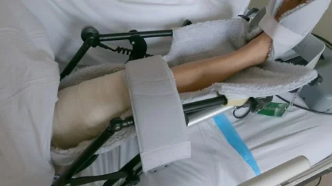 Post-operative physiotherapy after total knee replacement surgery. Stock Footage 241195916