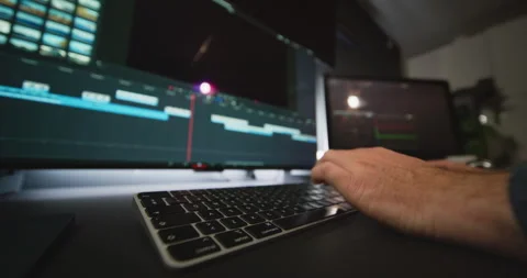 Post-Production Studio With Editor Reviewing And Editing Video Timeline 動画素材 313467398