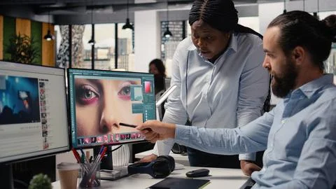 Post production team working on image selection on editing software PC Stock Photos