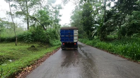 Post-Rain Merapi Road POV – Behind Loaded Sand Truck Stock Footage 321103311
