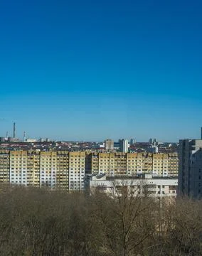 Post Soviet apartment blocks under clear sky with mustard complex Stock-Fotos