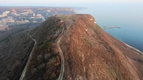Post-Sunset Drone Flight Over Bizone Ridge Toward Kavarna Coast Stock Footage 322790421