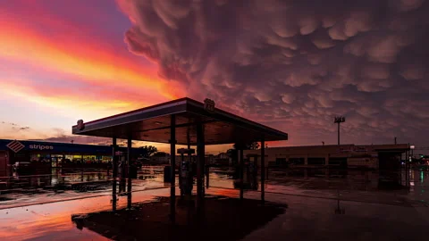 Post, Texas, USA - May 26th 2024 - Gas Station and Mammatus Clouds at Sunset Stock Footage 277375134