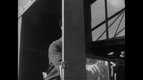 Post War Civil Engineering, man operating a bulldozer, UK 1950s Stock Footage 143965293