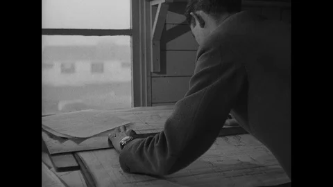 Post War Civil Engineering, men using metal bars at construction site, UK 1950s Stock Footage 143964498