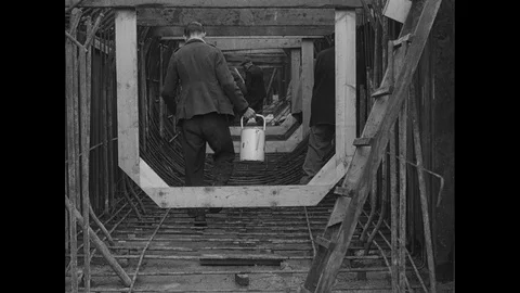 Post War Civil Engineering, men preparing concrete shuttering on site, UK 1950s Stock Footage 143964551