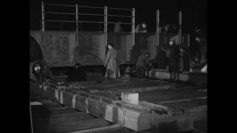 Post War Civil Engineering, men building railway bridge over night, UK 1950s Vídeos de archivo 143965456