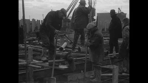 Post War Civil Engineering, workers punning concrete on site, UK 1950s Video stock 143964823