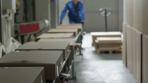 Post warehouse. Parcels move along a conveyor belt in the post-sorting departmen Stock Footage 156581524