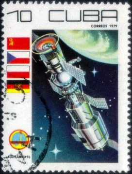 Postage stamp with the image of Space docking. From the series on Space day.. Фото