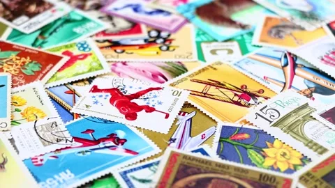 Postage stamps from different countries rotating around. Stock Footage 167336937