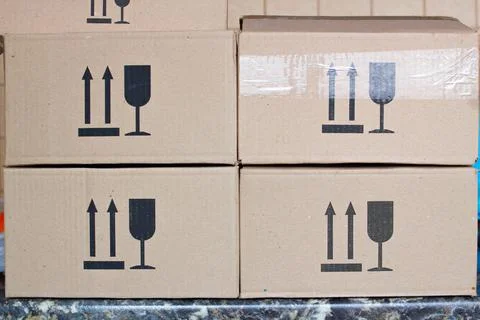 Postal boxes. Cardboard postal box package parcel in a post office warehouse Stock Photos