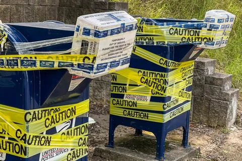 Postal Drop Boxes Are Taped Shut With Yellow Caution Tape Foto stock
